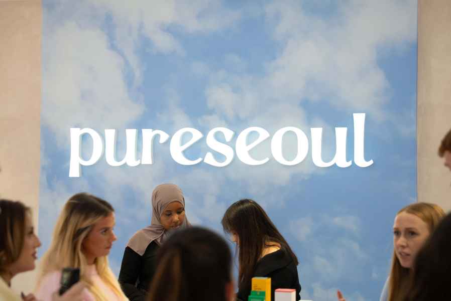 PURESEOUL Cardiff, brand feature wall behind the trading floor by JPS Services